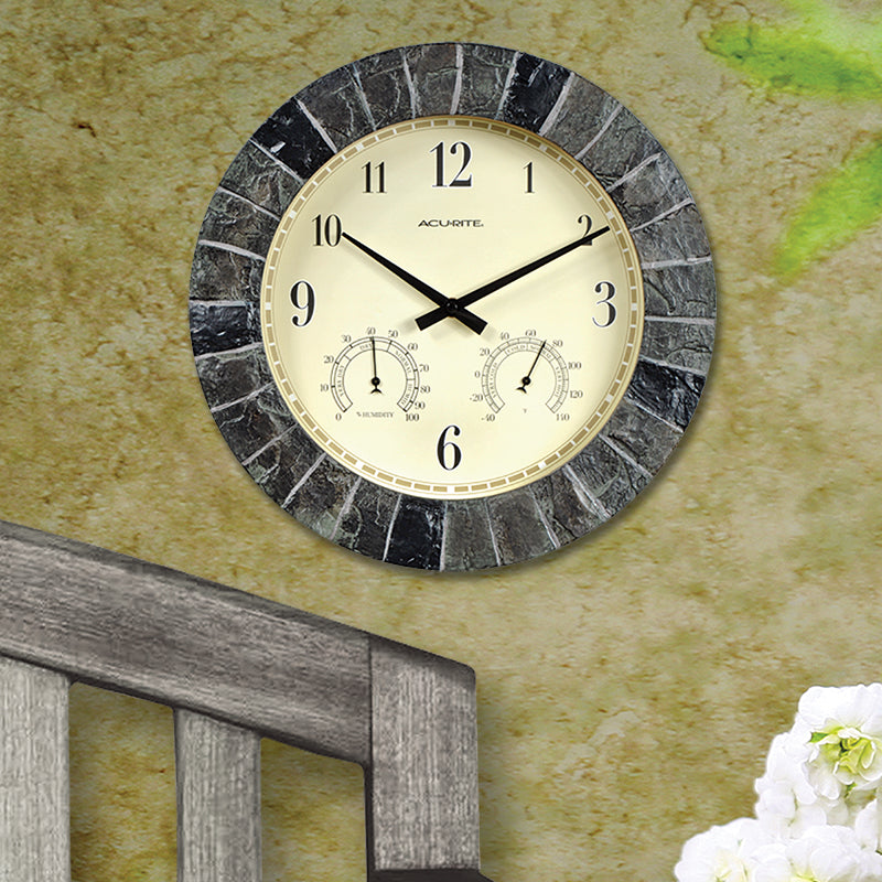 AcuRite outdoor clock hanging on a wall