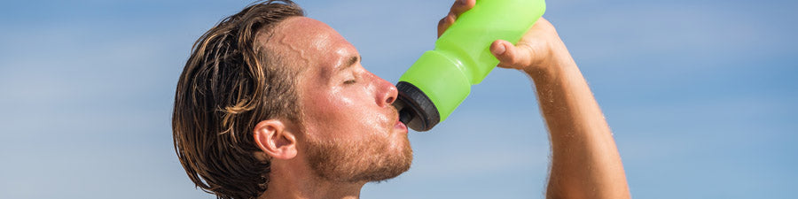 Drinking from an athletic water bottle