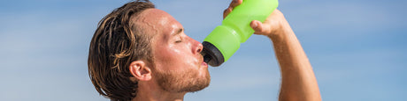 Drinking from an athletic water bottle