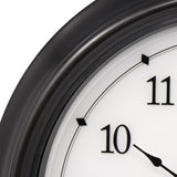 Close-up of AcuRite illuminated outdoor clock with temperature and humidity sensors