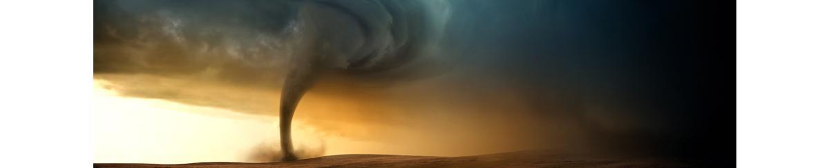 Tornado touching down from colorful storm cloud