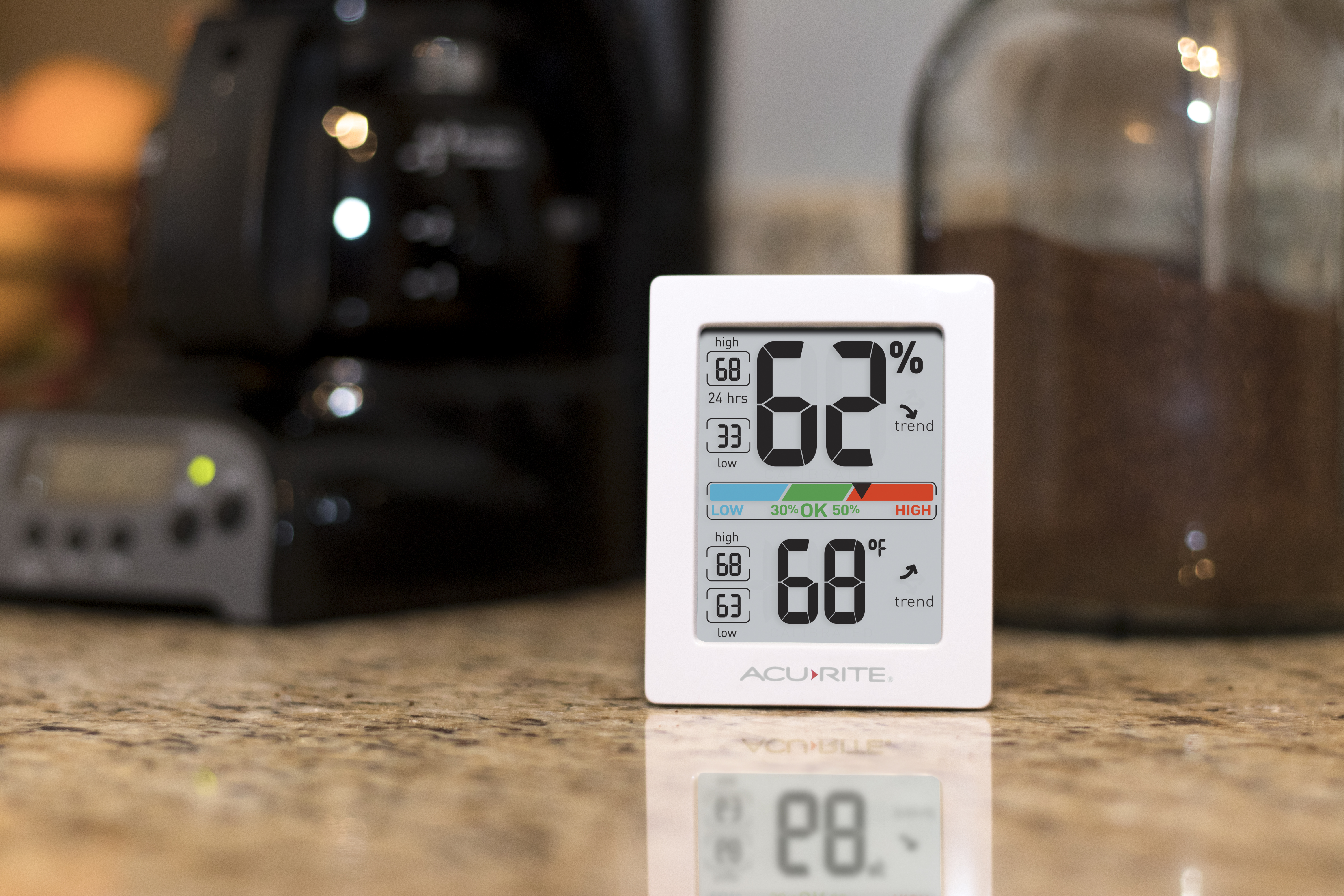 AcuRite indoor temperature and humdity monitor on a kitchen counter