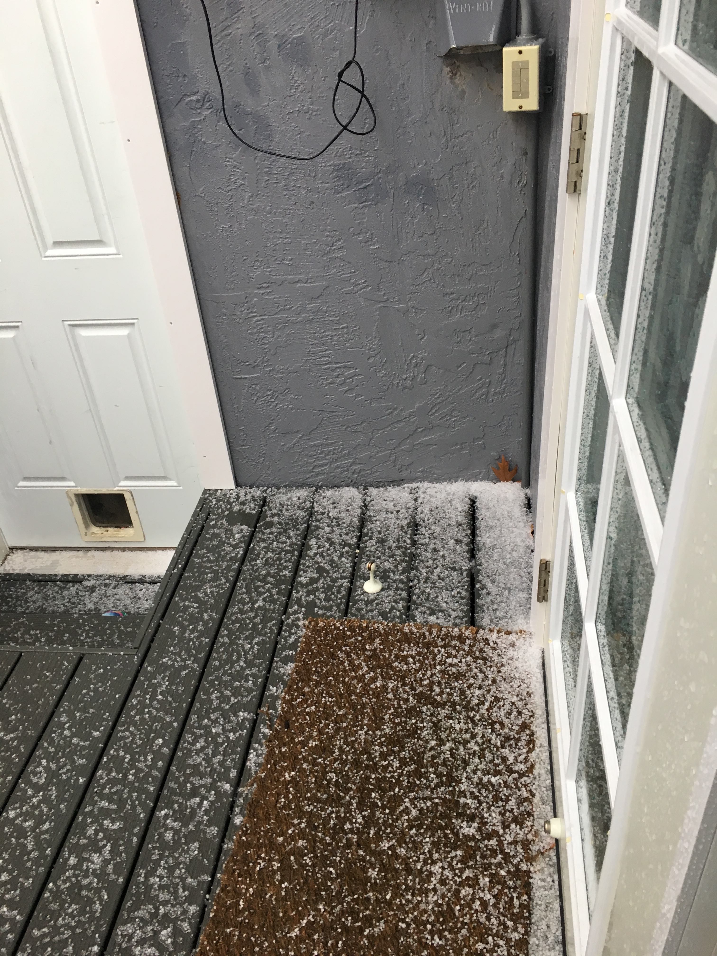 Hail accumulating at doorstep